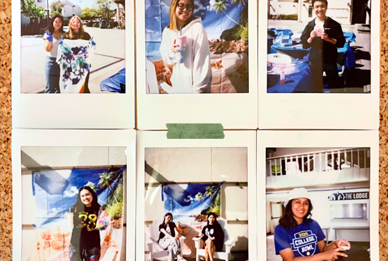 Student community polaroid photos on corkboard